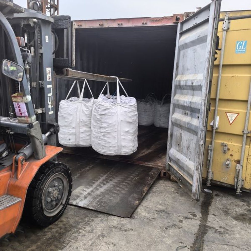 Loading bags into a container